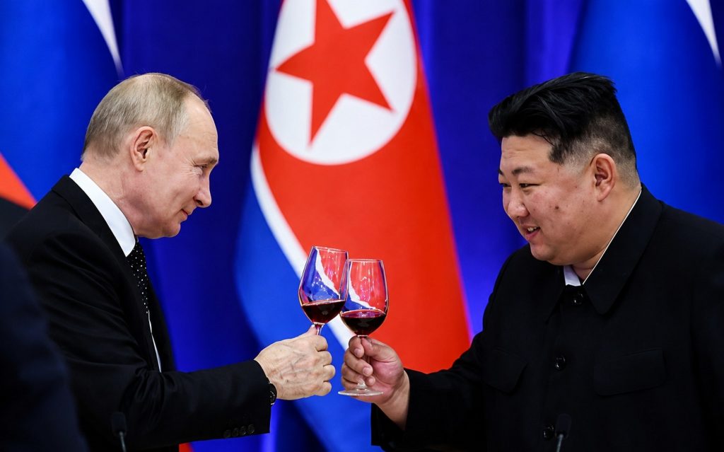 Путін та Кім.