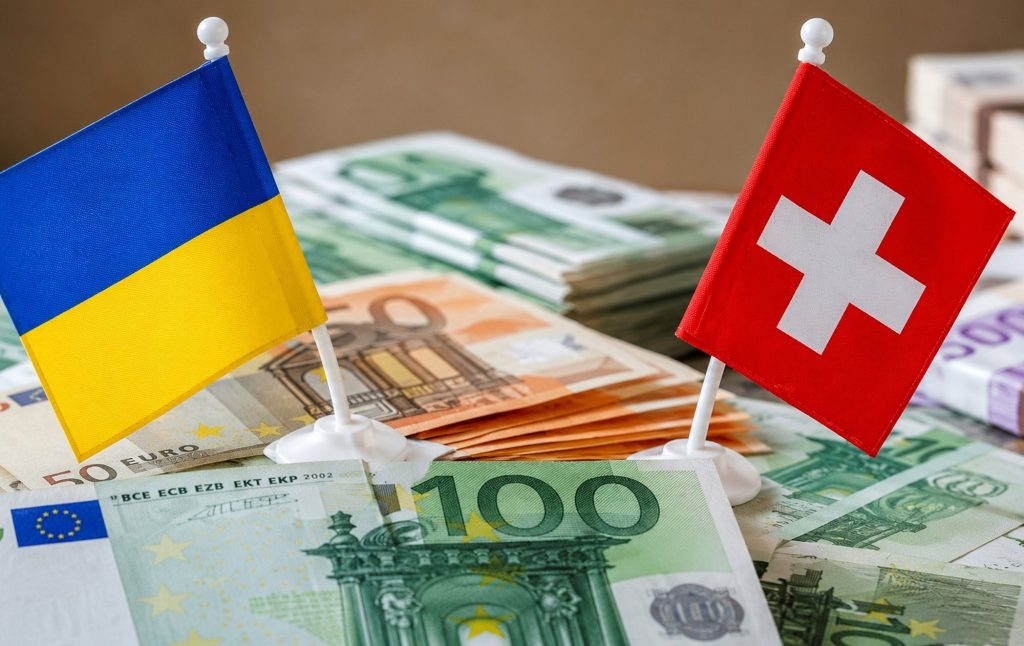 Прапори України та Швейцарії.